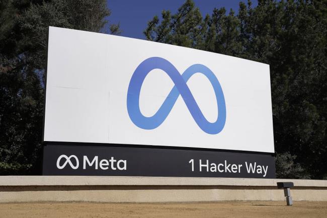 FILE - Facebook's me<em></em>ta logo sign is seen at the company headquarters in Menlo Park, Calif. on Oct. 28, 2021. me<em></em>ta CEO Mark Zuckerberg said Tuesday, July 18, 2023, the company is partnering with Microsoft to introduce the next generation of its AI large language model and making the technology known as LLaMA 2 free for research and commercial use. (AP Photo/Tony Avelar, File)