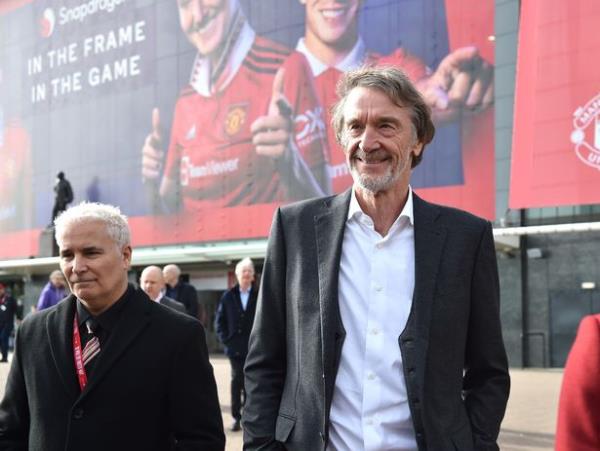 Sir Jim Ratcliffe taking a stroll outside Manchester United while smiling