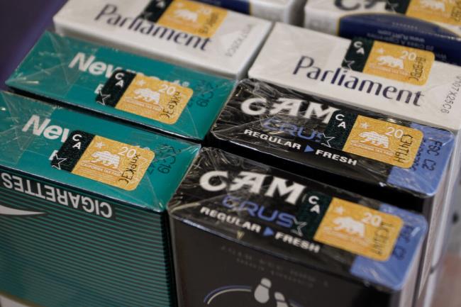 California cigarette tax stamps on packs of cigarettes at a liquor store in Los Angeles. Photo by Jo<em></em>nathan Alcorn, Reuters