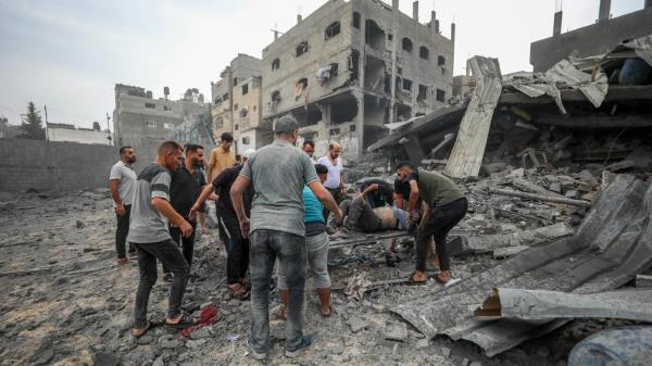 Palestinians evacuate wounded in Israeli aerial bombing on Jabaliya, near Gaza City, Wednesday, Oct.11, 2023.