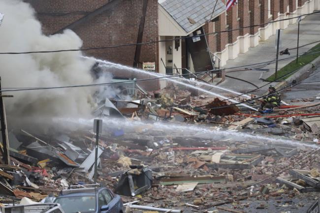 FILE - Emergency perso<em></em>nnel work at the site of a deadly explosion at a chocolate factory in West Reading, Pa., March 24, 2023. Natural gas leaked from a defective fitting at the Pennsylvania chocolate factory where a powerful explosion leveled one building, heavily damaged another and killed seven people, federal safety investigators said on Tuesday, July 18, as they sought to pinpoint a cause. (Jeff Doelp/Reading Eagle via AP, File)