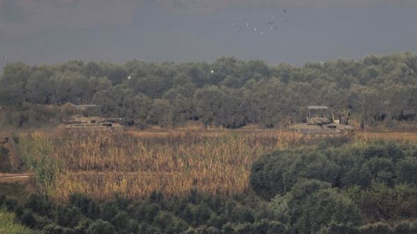 Israeli military tanks leave Gaza, during the temporary truce between Hamas and Israel, as seen from southern Israel November 24, 2023. REUTERS/Alexander Ermochenko