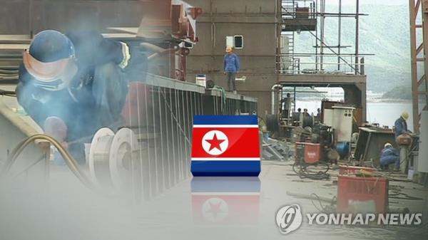 This image, provided by Yo<em></em>nhap News TV, shows North Korean workers dispatched abroad. (PHOTO NOT FOR SALE) (Yonhap)