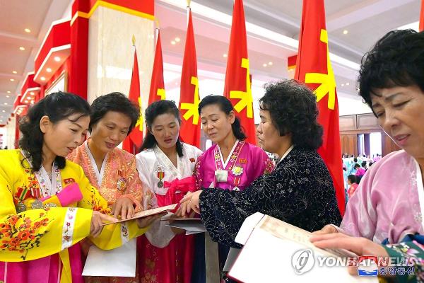 This photo, carried by North Korea's official Korean Central News Agency on Dec. 6, 2023, shows participants in the Fifth Natio<em></em>nal Co<em></em>nference of Mothers who received gifts from the ruling Workers' Party of Korea the previous day. (For Use o<em></em>nly in the Republic of Korea. No Redistribution) (Yonhap)