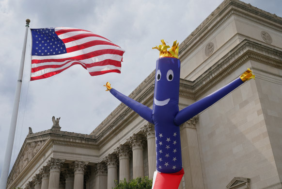 A stars-and-stripes balloon rises up beside the Natio<em></em>nal Archives, home to the Declaration of Independence, in Washington DC on July 3.