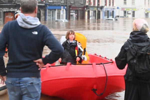 Dinghies had to be used to bring people to dry ground in Midleton, Co Cork, in the aftermath of the Storm Babet flooding on Wednesday. Picture: Eddie O'Hare