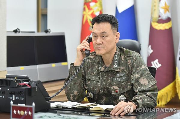 South Korea's Joint Chiefs of Staff (JCS) Chairman Adm. Kim Myung-soo speaks to his U.S. counterpart, Gen. Charles Q. Brown Jr., at his office in central Seoul on Dec. 12, 2023, in this photo provided by the South's JCS. (PHOTO NOT FOR SALE) (Yonhap)