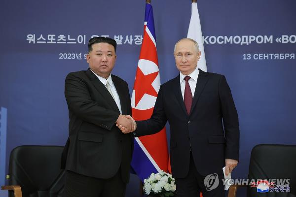 North Korean leader Kim Jong-un (L) shakes hands with Russian President Vladimir Putin ahead of their talks at the Vostochny Cosmodrome space launch center in the Russian Far East on Sept. 13, 2023, in this photo released by the North's official Korean Central News Agency the next day. (For Use o<em></em>nly in the Republic of Korea. No Redistribution) (Yonhap)