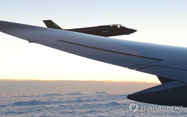 The South Korean presidential plane, carrying President Yoon Suk Yeol and his wife, Kim Keon Hee, is escorted by a Dutch Air Force plane as they visit the Netherlands for a four-day state visit on Dec. 11, 2023. (Yonhap)